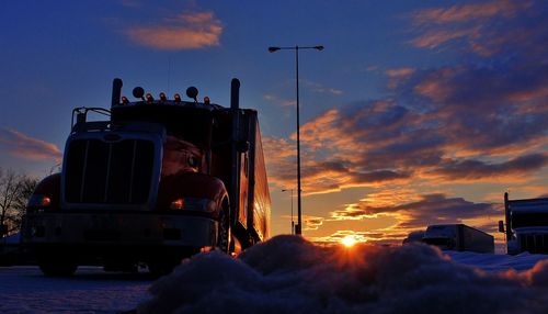 Semi truck at sunset